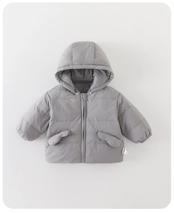 Detailed view of gray hooded puffer jacket with embroidered pockets and soft texture