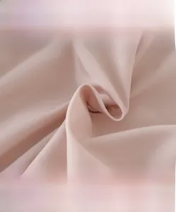 Close-up of soft pink high-density fabric texture for baby winter jumpsuits