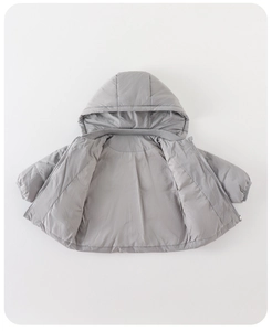 Detailed view of kids puffer jacket featuring warm hood and smooth zipper closure