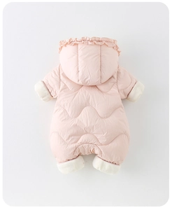 Detail of baby snowsuit showing wavy quilting pattern and ruffled hood in soft pink
