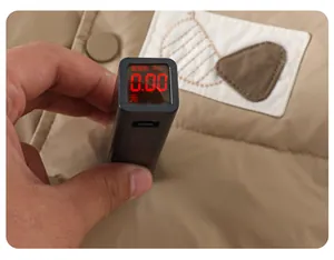 Close-up showing a fluorescent agent test on khaki baby down vest with zero reading