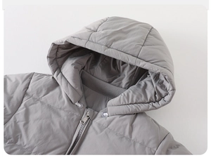 Close-up of grey hooded puffer jacket with quilting and premium resin zipper detail