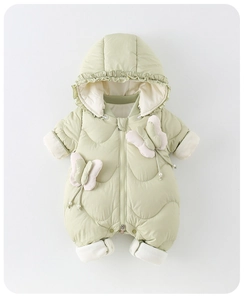 Macro view of light green baby winter romper with frilled hood and 3D bow detail