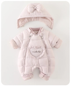 Close-up of pink polka dot baby snowsuit featuring heart pocket and double zippers