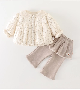 Flat lay detail of floral quilted jacket and grey leggings set for infant girls