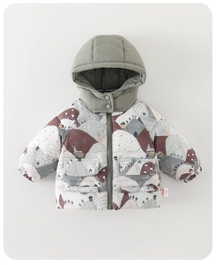 Detailed close-up of hooded baby winter jacket with cartoon mountain and cabin print