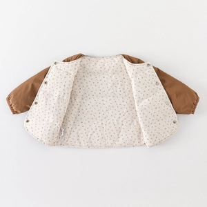 Kids warm down liner jacket with floral lining and snap buttons in a flat lay view