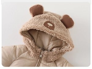 Detail of baby winter coat hood with fluffy bear ears and warm sherpa lining in khaki