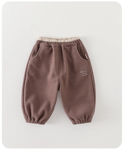 Close-up of knit cotton pants for baby boys with elastic waist and fall season print