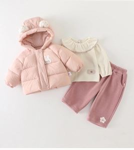 Detailed flat lay of pink infant winter set with hooded bunny jacket and floral pants