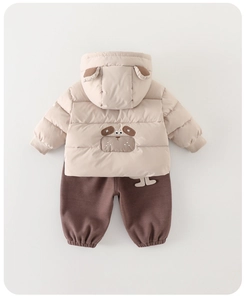 Detail view of baby boy's winter thick padded hoodie with 3D ears and brown pants