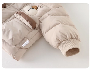Close-up of windproof ribbed cuffs and cute cookie embroidery on baby winter jacket