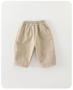 Close-up of khaki infant trousers with elastic waist and cute dog graphic detail