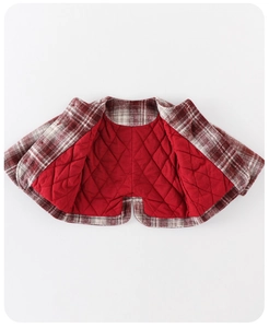 Detailed view of red and white plaid baby girl jacket with warm diamond quilted lining