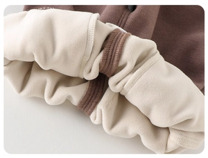 Macro detail showing the thick fleece lining and warm texture of baby winter pants