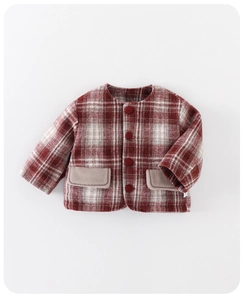Detailed view of red plaid wool coat for baby girls with classic buttons and pockets