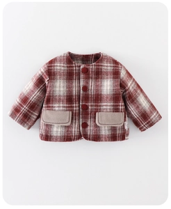 Detailed close-up of a warm red and white plaid wool jacket for baby girls