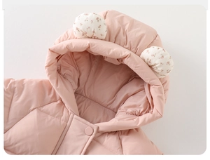 Detail of baby winter pink cotton coat featuring cute floral ears on a soft hooded design