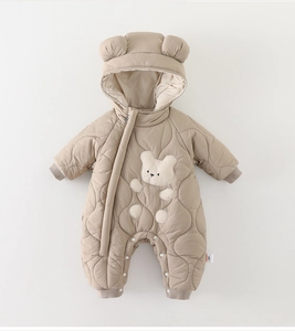 Detailed close-up of baby winter romper with quilted fabric and cute 3D bear ears hood