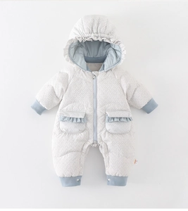 Detail of baby snowsuit with floral print, ruffled edges and ribbed windproof cuffs
