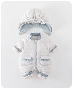 Detail of baby down snowsuit featuring detachable ruffled hood and zip-up floral design