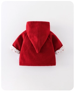 Detail view of red baby hooded coat with cherry floral lining and pointed hood design