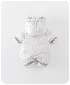 Detail of baby quilted white duck down romper with blue floral print and ribbed cuffs