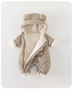 Close-up of quilted thermal fabric and cute bear ears on this baby hooded romper