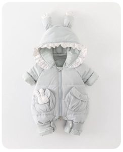 Detail of baby hooded romper with bunny ears and floral trim on light blue winter coat