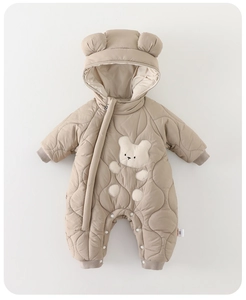 Detail of baby quilted hooded romper with bear embroidery and ribbed cuffs
