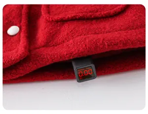 Detail of red winter coat showing pocket and fluorescent agent test result 0.00