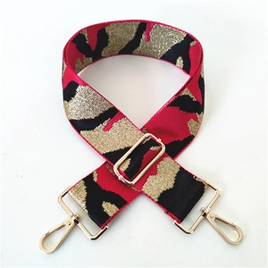 Adjustable wide replacement strap with red and gold woven pattern and metal hooks