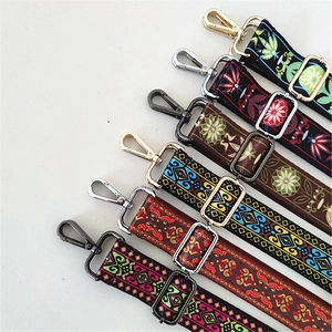 Detail of six ethnic style woven replacement bag straps with various patterns and metal hooks