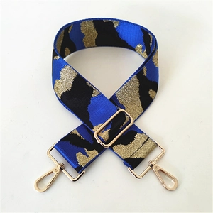 Adjustable wide woven shoulder strap in camouflage blue and gold with metal hooks