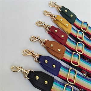 Adjustable rainbow woven bag straps with colorful leather ends and gold metal hooks