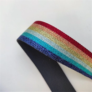 Adjustable rainbow glitter bag strap with colorful metallic thread and black canvas backing