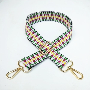 Adjustable ethnic style woven bag strap with geometric patterns and gold metal buckles