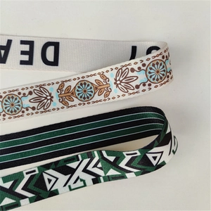 Close-up of three colorful ethnic-style woven polyester straps with intricate patterns