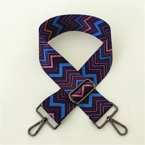 Detail of colorful ethnic style woven bag strap with gun metal lobster clasps