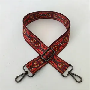 Detailed view of bohemian jacquard bag strap with gun-metal claps and floral pattern