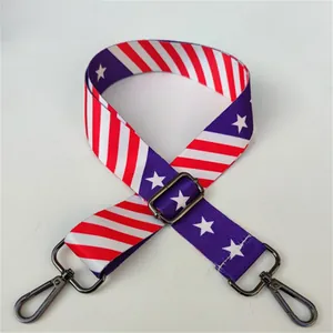 Detail of adjustable star and stripe pattern shoulder strap with gunmetal swivel hooks