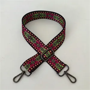 Close-up of ethnic colorful geometric strap with gunmetal rotating swivel hooks