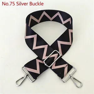 Close-up of ethnic style replacement bag strap with pink zigzag pattern and silver buckles