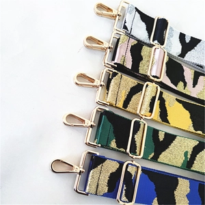 Macro view of thickened jacquard bag straps with gold metal hooks in five colors