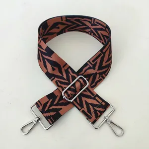 Detail view of ethnic style No. 76 woven shoulder strap with silver metal lobster clasps
