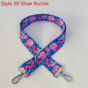 Blue adjustable bag strap with pink floral pattern and silver metal lobster clasps
