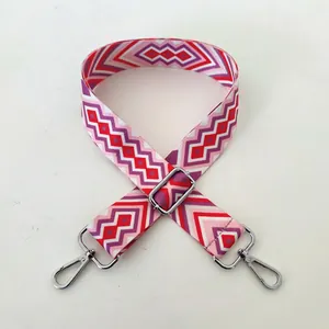 Close-up of No.96 silver buckle on wide ethnic woven strap with geometric wave pattern