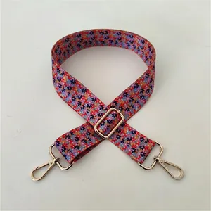 Floral print bag strap with multi-color flower pattern and adjustable gold metal hooks