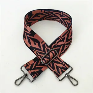 Close-up of ethnic geometric pattern wide strap with dark gunmetal swivel hook