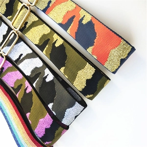 Detail of wide woven camo and rainbow bag straps with premium gold metal buckles
